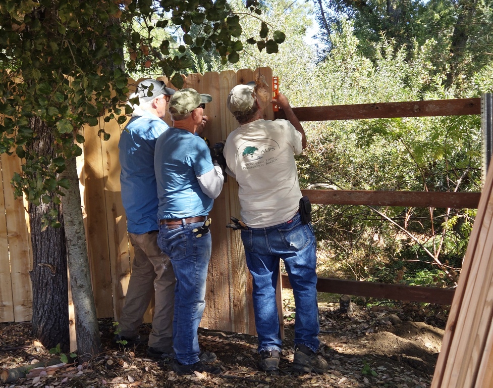Dave, Stan and Cory installing pickets.